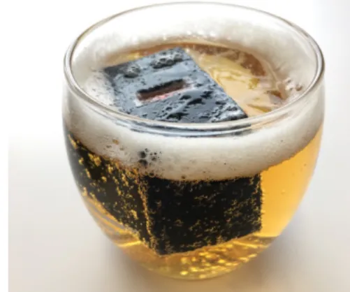 Fig. 1 Our smart ice cube prototype device measures alcohol content of beer.