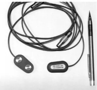 Fig. 2 　Example of a surface EMG electrode. This electrode  has  two  contacts  and  also  contains  a  preamplifier  for  differential amplification（Biometrics Ltd., UK）.