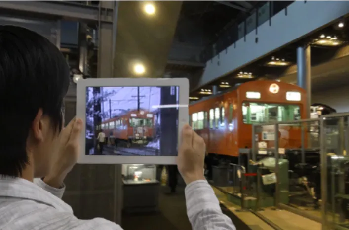 図 1  鉄道博物館におけるデジタル展示ケースの活用 （デジタル展示ケース  台車で GO ） [3]  図 2  東京国立博物館におけるデジタル展示ケースの活用 （デジタル展示ケース  自在置物 龍） [4]  ト｣を提示することができるようになり，より有効な展示手 法を開発することも可能になってきている．  時間的・空間的なコトをミュージアムの中で展示するた めの研究事例として，デジタル展示ケースの研究[2]が挙げ られる．デジタル展示ケースは，これまでの展示ケースの インタフェースそのままに，デジタル