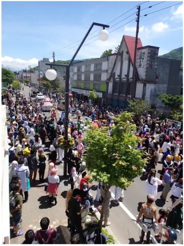 Figure 3: The Opening Parade of TMAF2014 in the main street of Toyako Onsen (21 June 2014) 