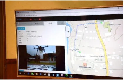 図 3.3  統合管理クラウドを利用したドローンポート状況の遠隔監視  ② ドローンポート付近の異常を検知（侵入検知等）した際、機体の安全な空中停止がなされることを 確認できた。（以下、図 3.4 参照）  図 3.4  第三者侵入検知時のドローンの飛行制御  （人がドローンポートから離れ着陸を再開するシーン）  課題：  ① 離陸してから着陸するまで、飛行中の機体位置を遠隔監視地点においてリアルタイムに表示する他 のサービスと連携する必要性が明らかになった  ② 実験専用機体を用いた検証だったため、他の機