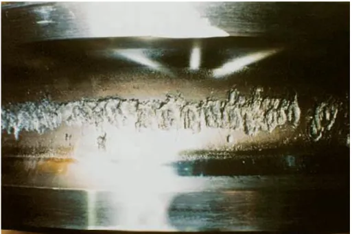 Fig. 1-8    Trace of flaking in the inner raceway of a deep groove ball bearing.  18)