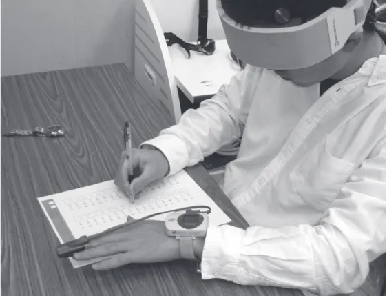 Fig 3  A subject attached sensor band during the calculation task in hypobaric chamber.