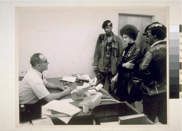Figure  3.  Kathleen  Cleaver  and  other  Black  Panthers  in  the  office  of  the  Prosecution  against  Huey P