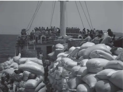 Figure 5. Cargo and passengers on the deck of the Liemba