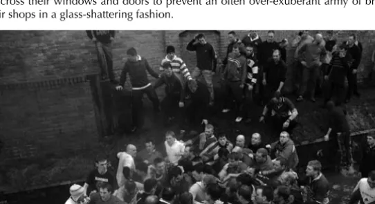 Fig. 12.1.  Shrovetide 2010. Activity in the river Henmore, as ball is temporarily hidden from view