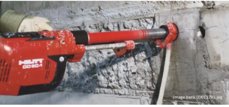 Figure 16 – Core drilling with a hand-held Hilti wet core drill with water-capture technology