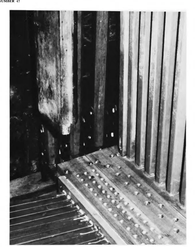 FIGURE 11.—Epistle organ, Cadereta, after the restoration of  1 9 7 5 - 1 9 7 8 . Elements (left to  right); conductors from pallet box to windchest for Cadereta Exterior; rackboards for Diez y  Setena Clara (2 ranks), Quincena Clara, and Fabiolete