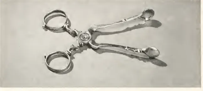 Figure i6. — Silver tongs in the rococo style, made by Jacob Hurd. ol" Boston, about 1750.