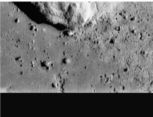 Fig. 12. Final image of the surface acquired by NEAR Shoemaker from a range of only ~129 m, the black area at the bottom represents portion of image lost when the spacecraft touched down on the surface and the antenna pointed away from Earth