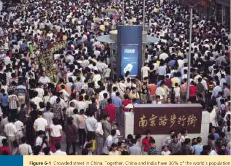 Figure 6-1  Crowded street in China. Together, China and India have 36% of the world’s population  and the resource use per person in these countries is projected to grow rapidly as they become more  modernized (Case Study, p