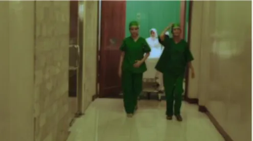 Gambar 3. dr.Kartini &amp; dr.Rohana keluar dari ruang operasi 