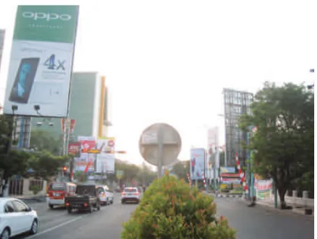 Figure 1. Frenzied giant size billboards placed on city infrastructure on Jalan Pandanaran (2014)