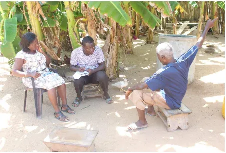 Figure 3 Field officers engaging a community resident of Anlo Beach 