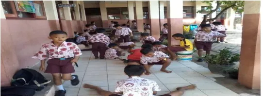Figure 1. The students were playing marbles outside the classroom 