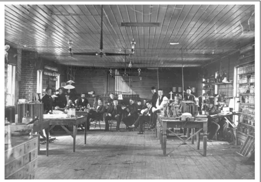 Figure 2:  Second floor interior of laboratory, February 22, 1880.  Edison is seated in center background with some of his laboratory assistants