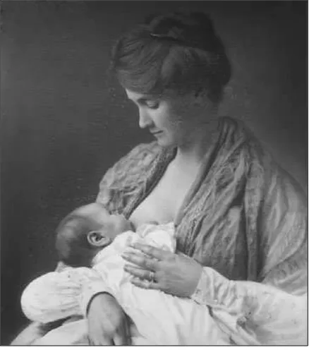 FIGURE 1–5. A mother nursing her infant about1900s. (With permission from M. M. Coates.)