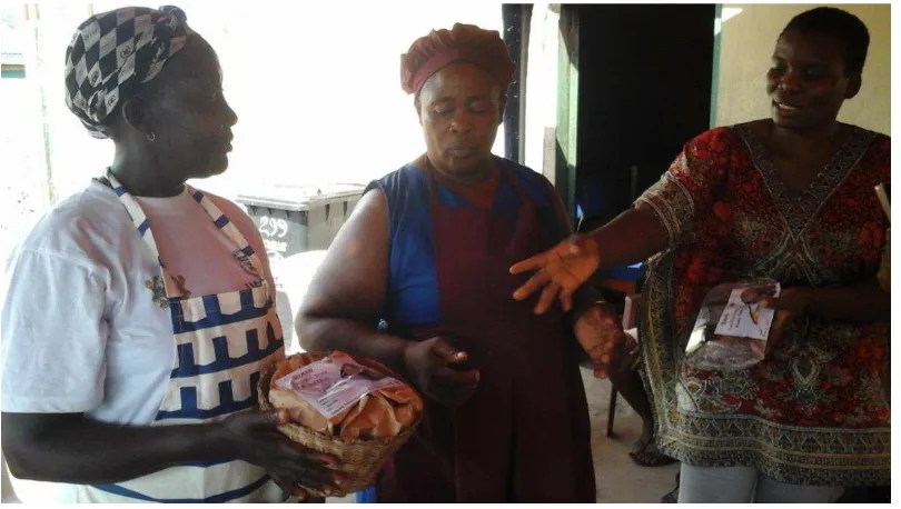 Figure 1 Participants displaying packaged fish with label 