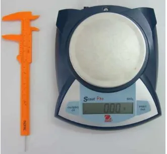 Figure 4. Panme ruler on the left and electric weight scale on the right used in biological samplings  