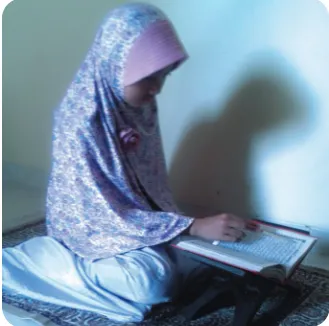 Gambar 5.10. Membaca al–Qur±n.