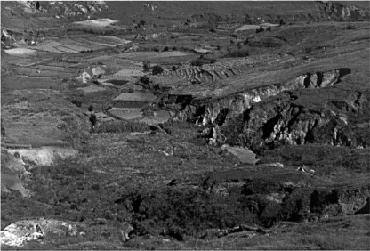 Fig. 2. Sustainable use of land and soil resources is impossible as long as immense gullies, called ‘Lavaka’, threaten rice ﬁelds withsedimentation problems: an example from Madagascar, near the village of Ambatofozy
