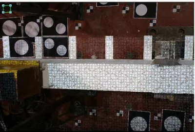 Figure 6. Example of the absence on signalized targets and the presence of a projected random pattern on the surface of the concrete beam during the testing 