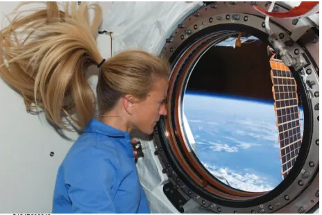 Figure 1: Astronaut Karen Nyberg looking at the blue planet while on board the International Space Station