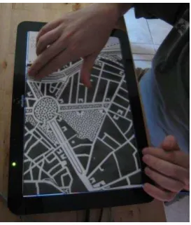 Figure 2. Touch the map! allows blind users to interact with a tactile map and retrieve names, distances and details using gestural interaction technique
