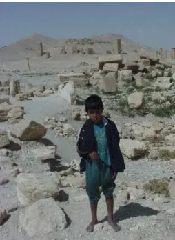 Figure 1. A Syrian child photographed with a first generation digital camera in the midst of the Palmyra ruins in 2000 before the conflict