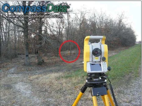 Figure 8. Total station and surveyed test point under vegetation in red circle  