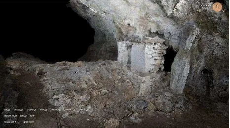 Figure 5. Shrine X-1. Note natural light from karst window in front of doorway. (Photo by D