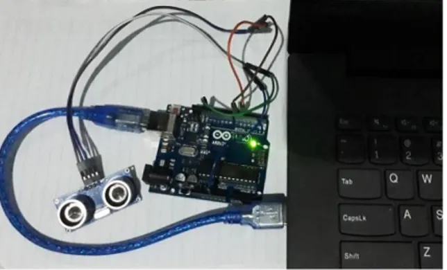 Gambar 7. Rangkaian sensor ultrasonik HC-SR04 dengan Arduino Uno 
