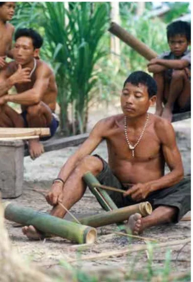 Figure 1. A member of the Maileppet group, Bottui, plays the lologui, the bamboo xylophone (photograph by G