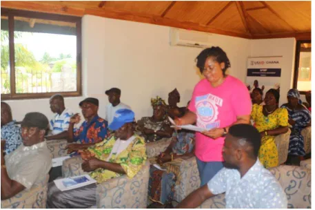 Figure 4 A picture of female participant in Volta Region commenting on the policy framework document 