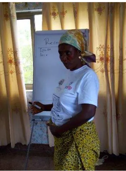 Figure 6 Madam Grace Bondzie from Apam demonstrating how she keeps records 