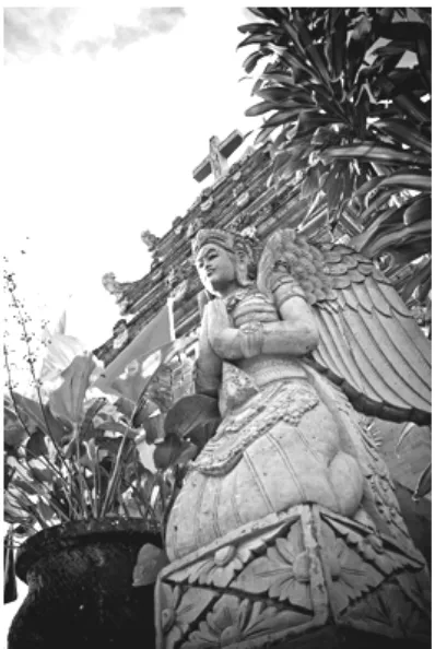 Figure 1. One of Gunarso’s photographs showing a representation of an acculturation in a statue of an angel with Balinese dress in front of Blimbingsari’s temple-like church (Gunarso, 2009)