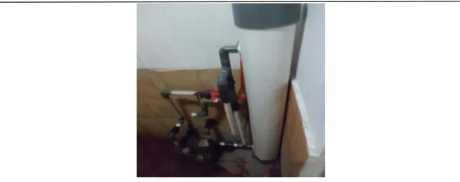 Gambar 6. Pemasangan alat penjernih air  4.  Pendampingan pemasangan alat penjernih air pada rumah warga