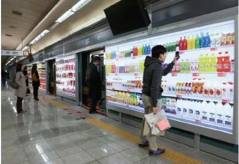Figure 1–4: Commuter shopping Home Plus’s virtual supermarket shelves. Image: http://theinspirationroom.com/daily/2011/homeplus-virtual-subway-store 