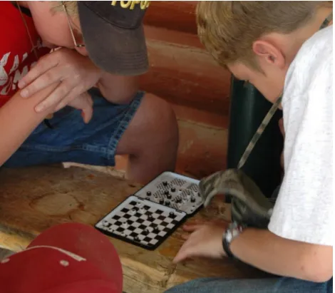 Figure 2–5. Intense game of chess unfolding in a cheap magnetic travel set. Photo (cropped): https://www.flickr.com/photos/wfryer/4806518911/in/photolist–8jJEBH–6akZjs 