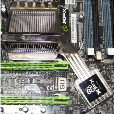 Figure 1.2 shows the chipset of a motherboard, with the heat sink of the Northbridge, at  the top left, connected to the heat‐spreading cover of the Southbridge, at the bottom right