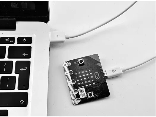 Figure 1-2 shows a micro:bit attached to a laptop. This laptop happens to be an Apple, but themicro:bit can be used with a Windows, Linux, Apple, or even Raspberry Pi computer.