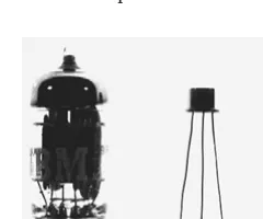 FIGURE 0.6 Vacuum tube, single transistor, and chip transistor (the dot). [Reprint Courtesy ofInternational Business Machines Corporation, copyright © International Business MachinesCorporation]