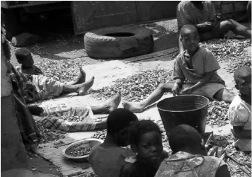 Figure 2. Children from poor communities engaged in paid work (groundnut shelling) in Lilongwe