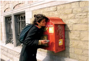 Figure 4: A participant listening to the echo of a post box (photo: Constant vzw).