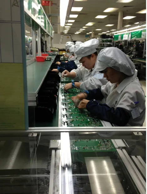 Figure 1-3. Factory workers in China assemble circuit boards. (Photo courtesy Dragon Innovation)