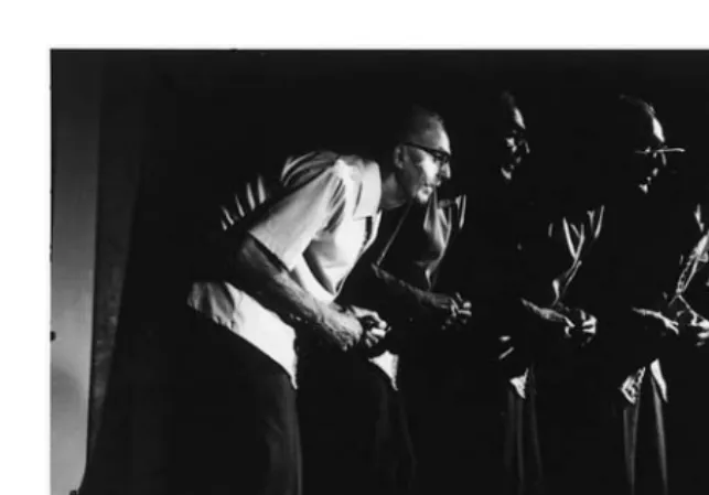 FIGURE 1A 74-year-old man with 9 years of bilateral parkinsonism demonstratedby hypomimia, hand tremor and posturing, stooped posture, and a shufﬂing gait.