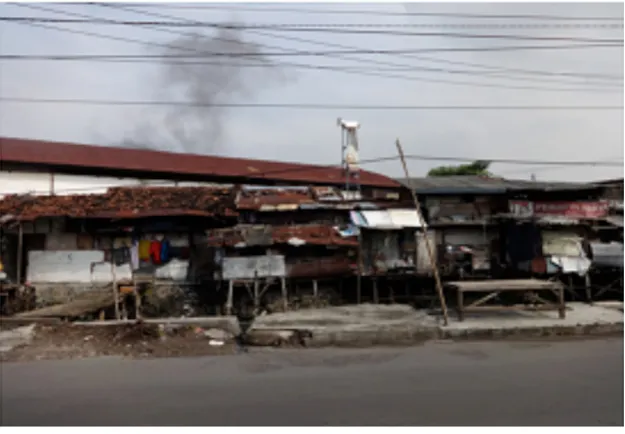 Fig 1–A part of dense area at the study site, bordering by a small river and there is a traditional market on the back of  row of  houses.