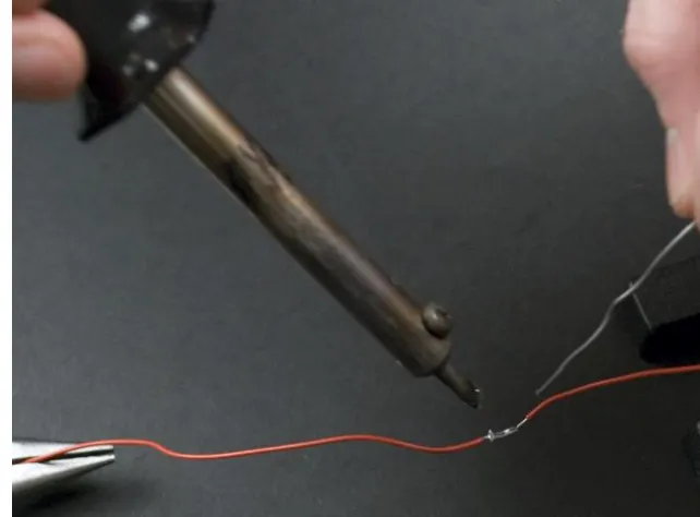 Figure 3-37. Removing the soldering iron and solder from the joint