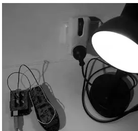 Figure 2-14. Arduino and shield using an appliance remote control to activate a lamp 
