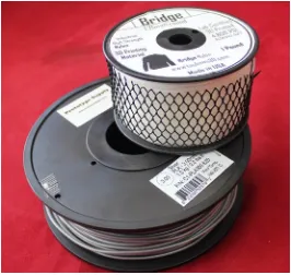 Figure 7-1. Typical spools of nylon (top) and PLA (bottom) filament